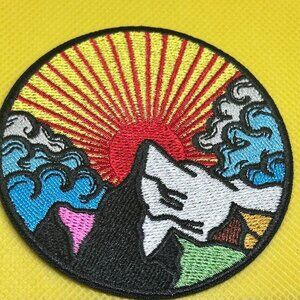 Multi-coloured mountain sunrise embroidered patch